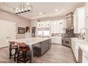 Spacious kitchen boasts modern appliances, a large center island, and stylish cabinetry at 18346 W Rancho Ct, Litchfield Park, AZ 85340