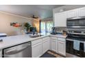 Bright kitchen with stainless steel dishwasher and sink with a view to outdoor patio at 20100 N 78Th Pl # 2098, Scottsdale, AZ 85255