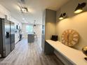 Bright kitchen featuring modern cabinets, stainless steel appliances, and a center island with seating at 3345 E Edgewood Ave, Mesa, AZ 85204