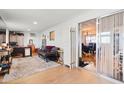 Open office area with views to dining, a comfortable sofa, and sliding glass doors at 7807 E Main St # Aa-8, Mesa, AZ 85207