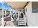 Inviting covered porch with seating, perfect for relaxing and enjoying the outdoors at 7807 E Main St # Aa-8, Mesa, AZ 85207