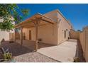 Private backyard featuring a covered patio, offering a perfect space for relaxation and entertaining at 1027 W Julie Dr, Tempe, AZ 85283