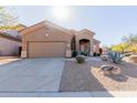 Charming single-story home featuring a well-manicured yard and an attached two-car garage at 10351 E Pine Valley Dr, Scottsdale, AZ 85255