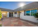 Exterior patio with tiled flooring and gated access at 10521 W Roundelay Cir, Sun City, AZ 85351