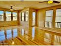 Bright living room featuring gleaming hardwood floors and access to an outdoor balcony at 15221 N Clubgate Dr # 2112, Scottsdale, AZ 85254