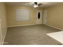 Bright and airy living room with tile floors, a large window, and neutral-colored walls at 1533 W 7Th St, Tempe, AZ 85281