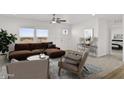 Bright living room featuring a stylish sofa, modern furniture, and scenic views from large windows at 164 S Oak Rd, Maricopa, AZ 85139