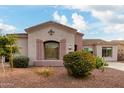 Charming home featuring decorative shutters, lovely landscaping, and a well maintained desert front yard at 1919 E Gary Way, Phoenix, AZ 85042