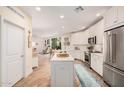 Spacious kitchen with stainless appliances, island, and easy access to the living area at 2511 W Queen Creek Rd # 163, Chandler, AZ 85248