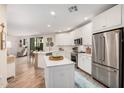 Open-concept kitchen features stainless steel appliances and seamless flow to living area at 2511 W Queen Creek Rd # 163, Chandler, AZ 85248