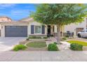 Inviting single-story home with well-maintained desert landscaping, a spacious garage, and a covered entrance at 2693 E Lodgepole Dr, Gilbert, AZ 85298