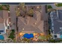 Aerial view of a home showcasing a backyard oasis with a pool, spa, and putting green at 2998 E Waterman Way, Gilbert, AZ 85297