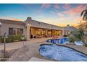 Beautiful backyard pool and spa area with desert landscaping perfect for entertaining at 2998 E Waterman Way, Gilbert, AZ 85297
