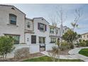 Charming two-story townhome with landscaped front yard and inviting walkway at 4077 S Sabrina Dr # 107, Chandler, AZ 85248