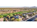 Stunning aerial view of homes, desert landscape, and golf course community, Arizona at 42019 N Golf Crest Rd, Anthem, AZ 85086