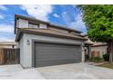 Charming two-story home featuring a gray two-car garage and a well-maintained front yard at 504 E Quentin Ln, San Tan Valley, AZ 85140