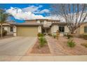 Charming two-story home featuring a well-manicured front yard and a spacious two-car garage at 714 W Desert Hills Dr, San Tan Valley, AZ 85143