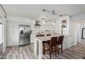Modern kitchen with stainless steel appliances and a beautiful quartz countertop island at 7751 E Glenrosa Ave # A1, Scottsdale, AZ 85251
