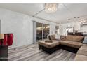 Comfortable seating in a cozy living space with tile floors and modern lighting at 7751 E Glenrosa Ave # A1, Scottsdale, AZ 85251
