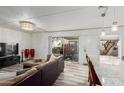 Open-concept living area with a large sliding door for natural light and outdoor access at 7751 E Glenrosa Ave # A1, Scottsdale, AZ 85251