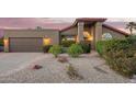 Charming single-story home with a well-manicured front yard and desert landscaping at 10500 E Mission Ln, Scottsdale, AZ 85258