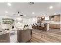 A bright and spacious living room and kitchen area with hard wood floors, and modern decor at 1326 E Catalina Dr, Phoenix, AZ 85014