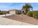 Charming home featuring desert landscaping, a two-car garage, and a welcoming entrance at 17228 N Estrella Vista Dr, Surprise, AZ 85374