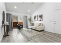 Well-lit living area with balcony access, contemporary design, and comfortable seating at 1942 S Emerson -- # 222, Mesa, AZ 85210