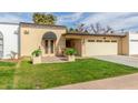 Well-maintained single-story home with a neatly manicured lawn and a convenient two-car garage at 2510 E Crittenden Ln, Phoenix, AZ 85016