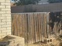 Wooden gate with metal frame for secure side yard access at 2934 W Hartford Dr, Phoenix, AZ 85053