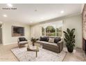 Bright living room featuring a large window offering ample natural light and stylish furnishings at 3512 N Chambers Ct, Scottsdale, AZ 85251