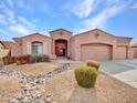 Charming single-story home boasting a three-car garage and desert landscaping for easy maintenance at 4215 W Reddie Loop, Phoenix, AZ 85083