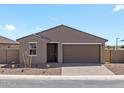 Charming single-story home featuring a gray exterior, landscaped front yard, and a two-car garage at 4351 W Jeanette Ln, San Tan Valley, AZ 85144