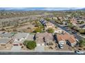 Wide aerial shot features the neighborhood and surrounding desert with mountain views in the distance at 4624 W Heyerdahl Ct, New River, AZ 85087
