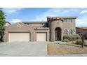 Charming home exterior featuring a three-car garage and a unique turret-style entrance at 4624 W Heyerdahl Ct, New River, AZ 85087