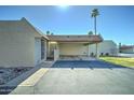 A charming single-story home with covered parking and desert-friendly landscaping at 5213 S Monaco Dr, Tempe, AZ 85283