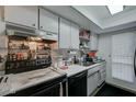 Compact kitchen featuring appliances, ample storage, and efficient design at 5213 S Monaco Dr, Tempe, AZ 85283