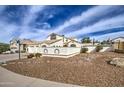 Beautiful home with mature landscaping, hardscape and a basketball court at 6614 E Portia St, Mesa, AZ 85215