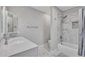 Well-lit bathroom showcasing marble floors and shower, a white vanity, and modern fixtures at 6913 E Kings Ave, Scottsdale, AZ 85254