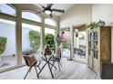 Cozy dining area near the window with comfortable chairs and views of the beautiful outdoor landscape at 11919 E Del Timbre Dr, Scottsdale, AZ 85259