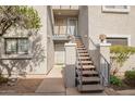 Building exterior with staircase leading to the upper level units at 15402 N 28Th St # 201, Phoenix, AZ 85032