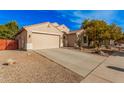 Inviting home with a two-car garage, desert landscaping, and a well-manicured front yard for curb appeal at 15788 W Sierra St, Surprise, AZ 85379