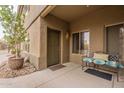 Charming condo entrance with bench seating, desert landscaping, and covered walkway at 16734 E La Montana Dr # 103, Fountain Hills, AZ 85268