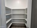 Walk-in pantry offering ample storage space with multiple shelves at 18032 W Vogel Ave, Goodyear, AZ 85338