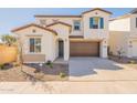 Charming two-story home with a two car garage, low maintenance yard and neutral color scheme at 2180 N Iowa St, Chandler, AZ 85225