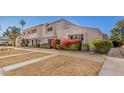 Attractive townhome featuring desert landscaping and colorful flowering bushes at 2233 W Farmdale Ave # 2, Mesa, AZ 85202