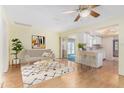 Relaxing open-concept living room flowing into a kitchen with a breakfast bar at 2421 E Del Rio Dr, Tempe, AZ 85282