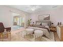 Comfortable bedroom with a ceiling fan, sliding door, and a stylish neutral color palette at 2421 E Del Rio Dr, Tempe, AZ 85282