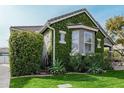 Charming home with lush landscaping, a gray stucco exterior, and inviting curb appeal at 2701 E Hobart St, Gilbert, AZ 85296