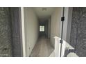 Bright hallway leading into the home, offering a glimpse of the layout and natural light at 37626 N Cowboy Ln, San Tan Valley, AZ 85140